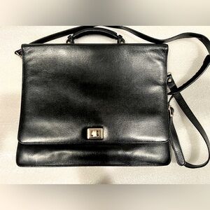 Tumi Black Leather Briefcase with a shoulder strap. Great Used Condition!